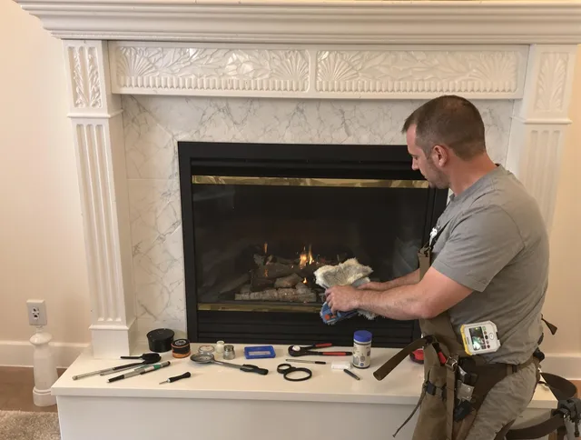 Westerly Chimney Sweep performing fireplace maintenance in Westerly, RI