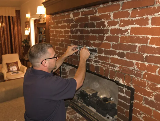 Westerly Chimney Sweep expert fixing a fireplace in Westerly, RI